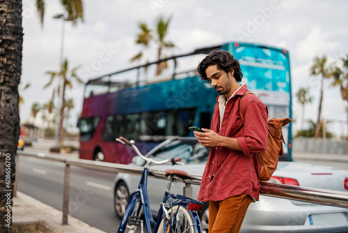 Photography A tourist using an online app for directions during his vacation in Spain
