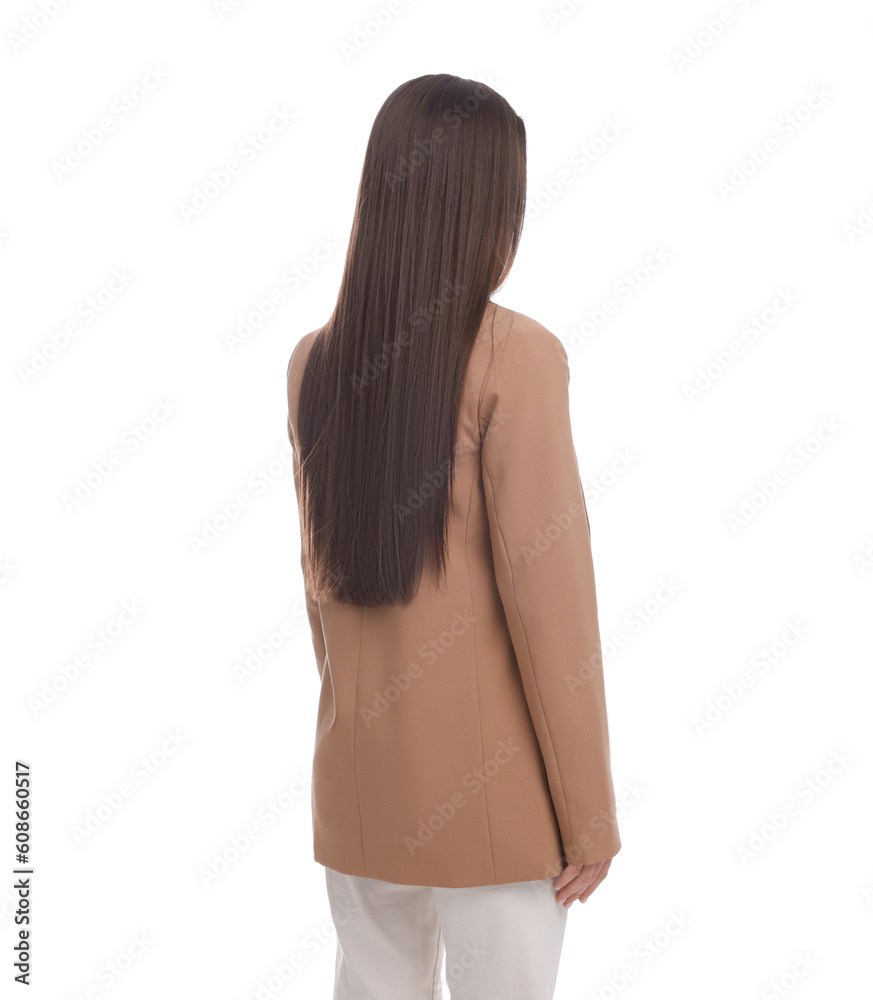 Naklejka premium Young businesswoman in suit standing on white background