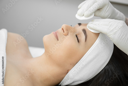 The care that every woman deserves where the beautician prepares the woman's skin for cosmetic procedures, providing maximum care and rejuvenation of the skin of the face. At reception in beauty salon