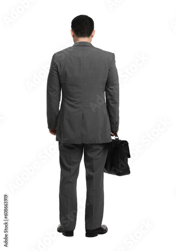 Businessman with briefcase posing on white background, back view