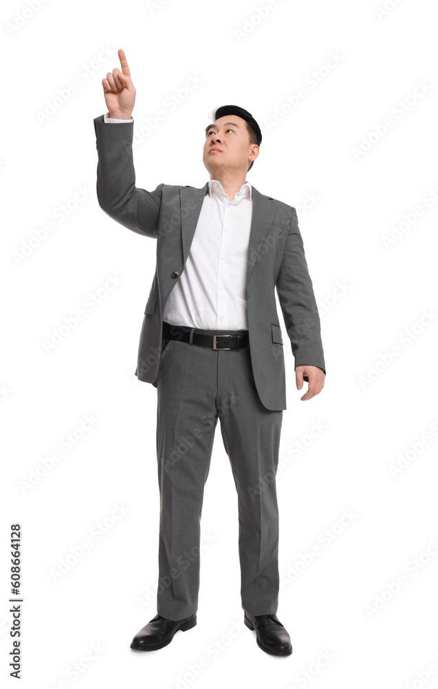 Businessman in suit posing on white background, low angle view Businessman in suit posing on white background, low angle view