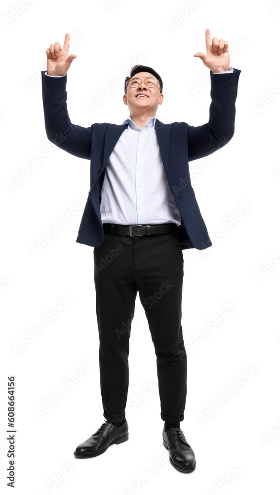 Businessman in suit posing on white background, low angle view Businessman in suit posing on white background, low angle view