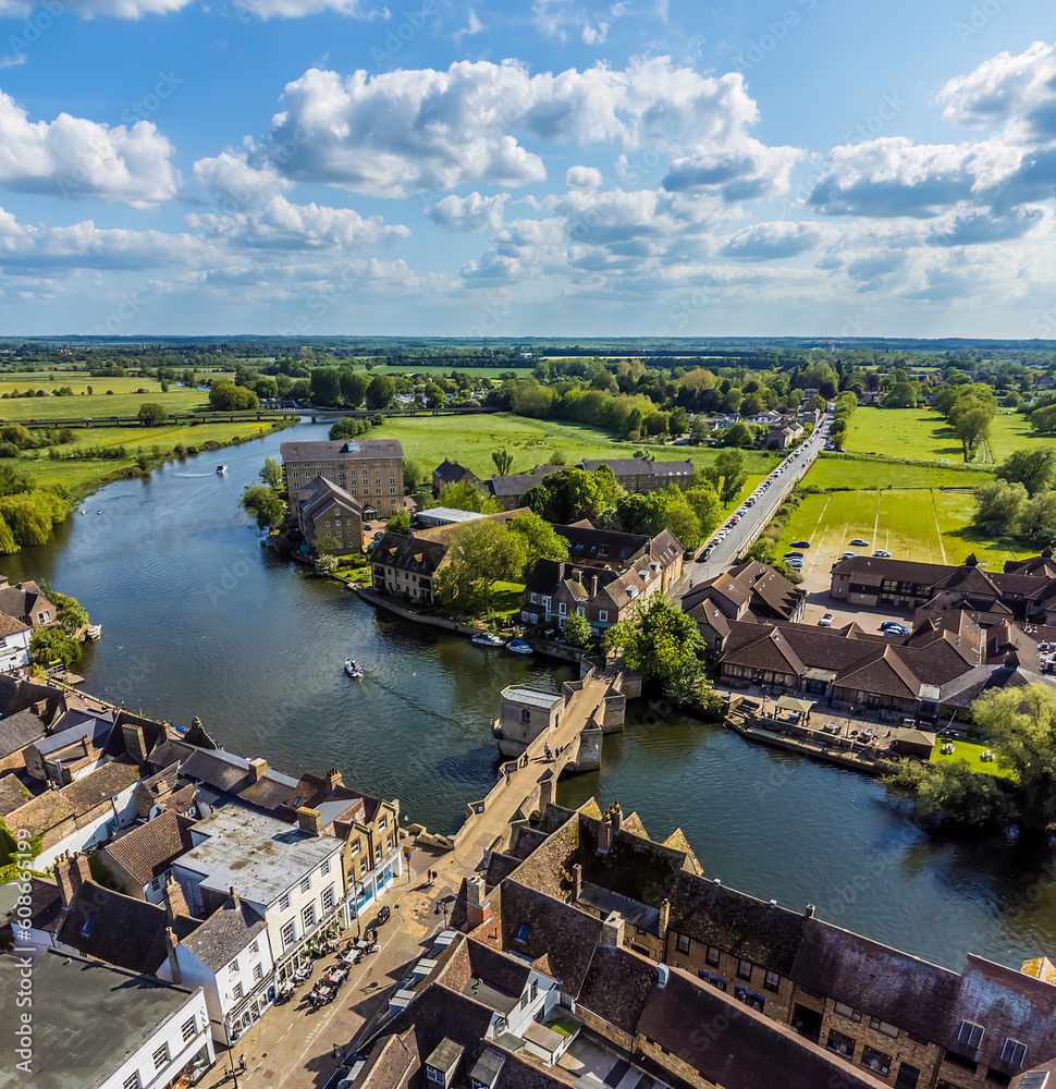 An aerial view above the bridge and causeway leading to the town of St Ives, Cambridgeshire in summertime