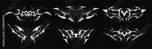Succubus Y2K womb tattoo. Demon heart sigil and butterfly with in neo tribal style. Vector set of tattoos photo