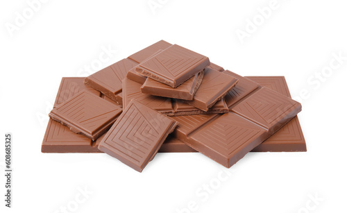 Pieces of delicious milk chocolate bars isolated on white