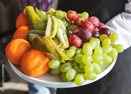 Fototapeta Naklejka Na Ścianę i Meble -  Bowl of fresh fruits on the table in the kitchen, closeup