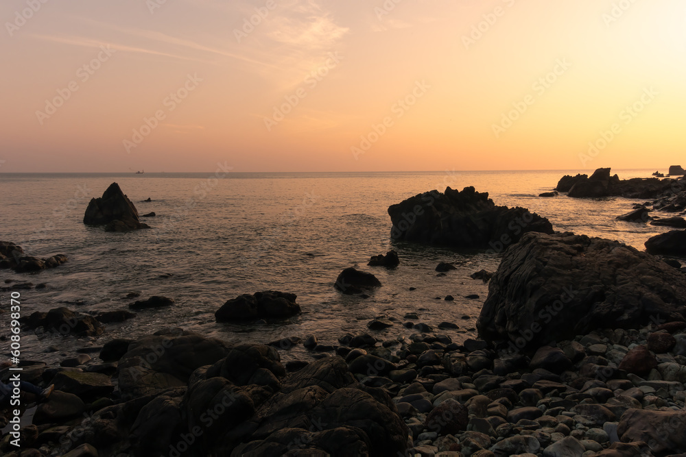 Beautiful view of a rocky shoreline during sunset