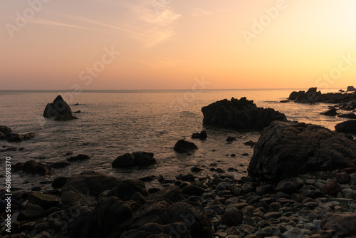 Beautiful view of a rocky shoreline during sunset