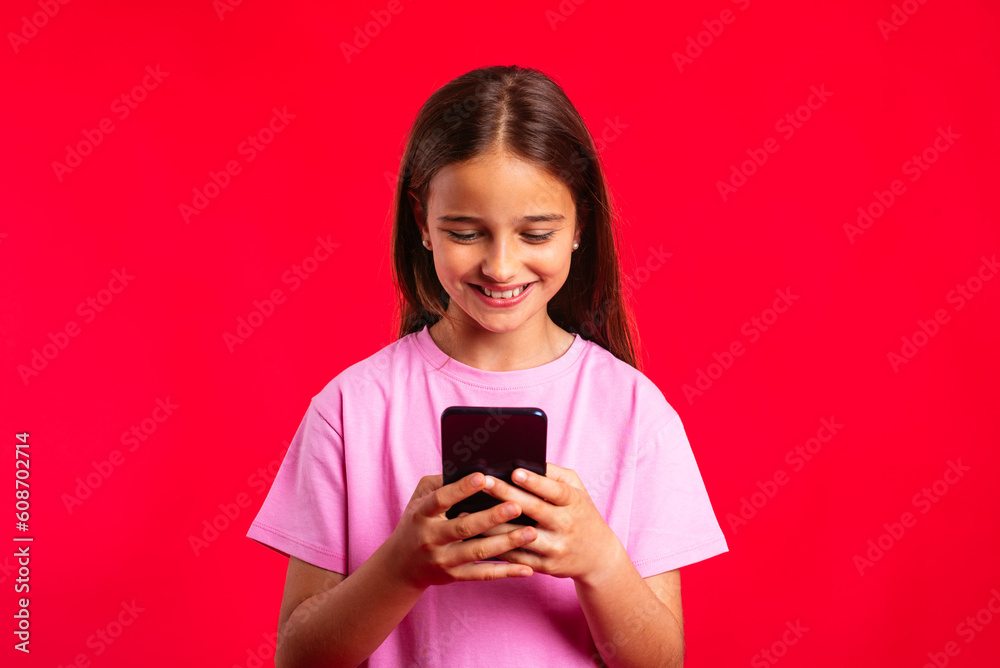 Cheerful teenager using smartphone Cheerful teenager using smartphone