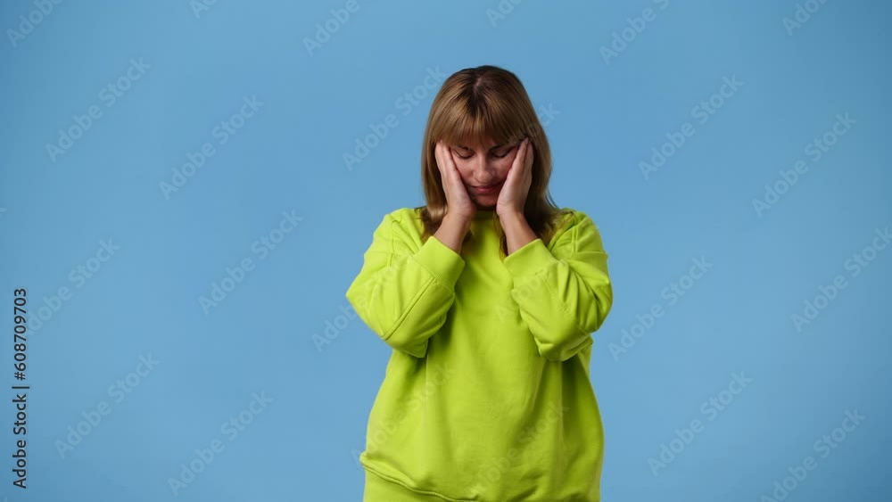 4k video of one girl posing for a video over blue background. 4k video of one girl posing for a video over blue background.