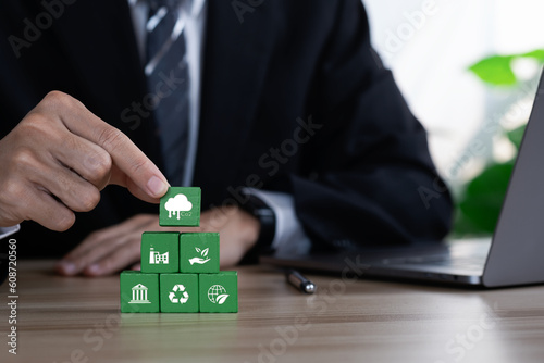 CO2 Net-Zero Emission -Carbon Neutrality concept. renewable energy, co2 emissions reduction, green production. Net zero and carbon neutral concept. Put wooden cubes with green net zero icon.