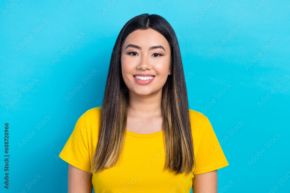 Closeup portrait of cute asian lady white teeth smiling wear yellow summer shirt isolated blue cyan shine color background Closeup portrait of cute asian lady white teeth smiling wear yellow summer shirt isolated blue cyan shine color background