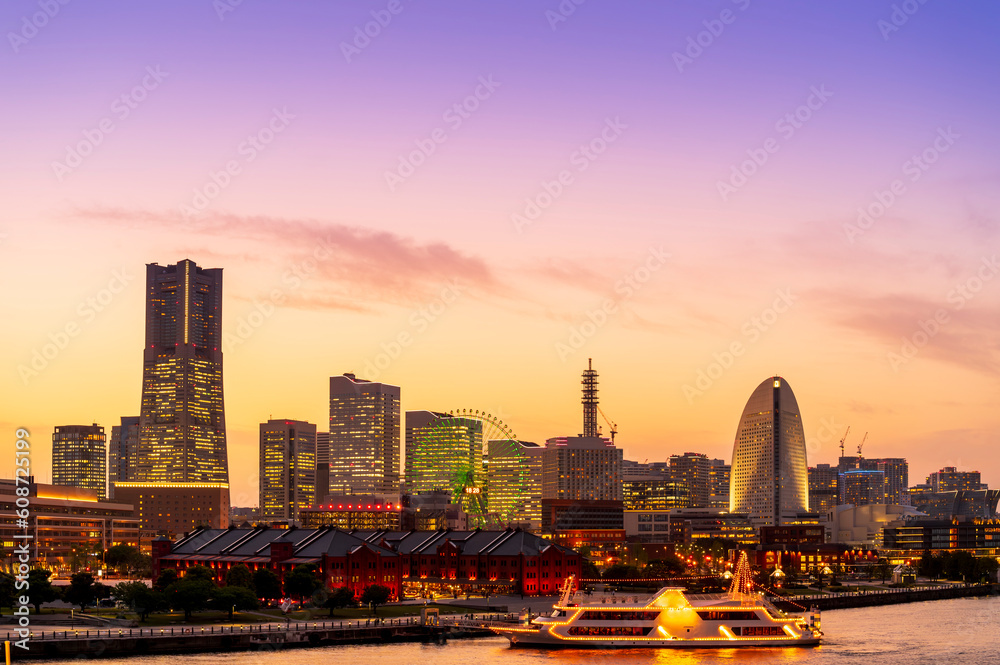 sweet gold sunset winter and light illumination from Cityscape of Yokohama city, Skyline and office building and downtown in Minatomirai Area, Yokohama city port, Kanagawa, Japan