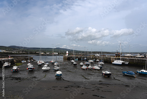 boats in the harbor at low tide photo