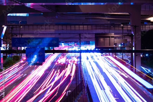 A night timelapse of the traffic jam at the city street in Tokyo photo