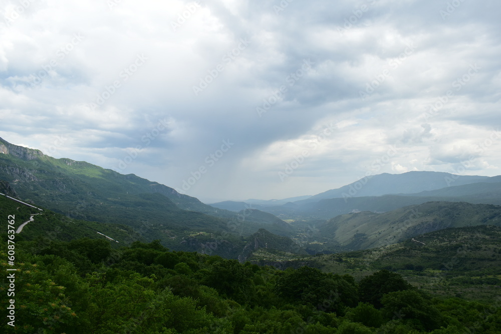 landscape of clouds and mountains in summer