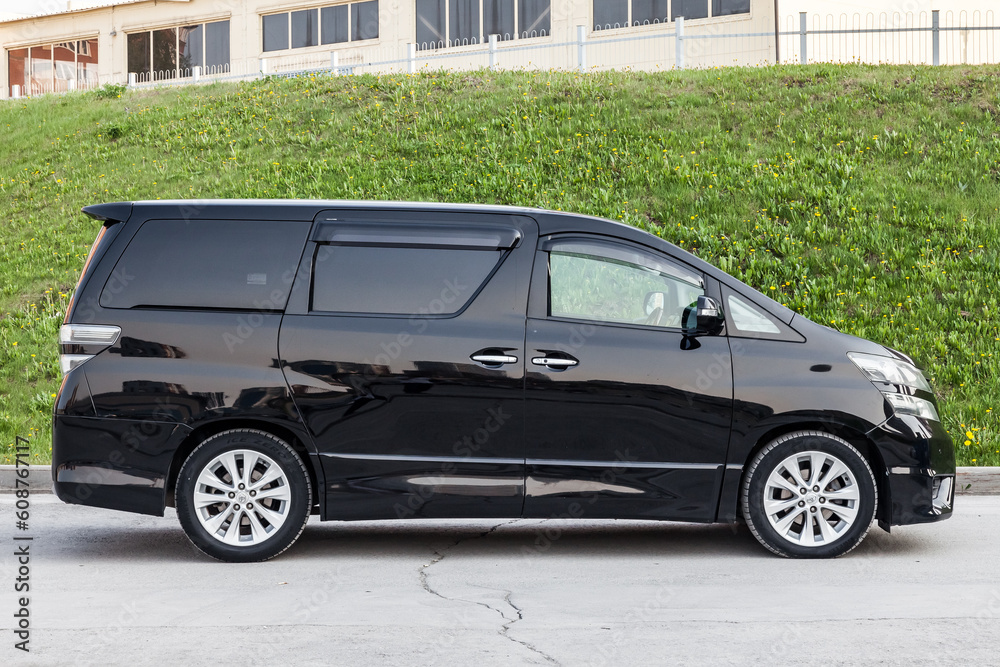 Side View of Toyota Vellfire japanese luxury minivan car in black color ...