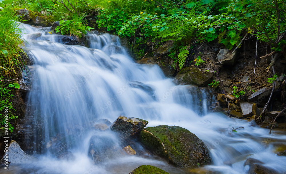 closeup small waterfall on mountain river closeup small waterfall on mountain river