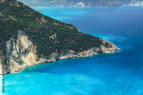 Crystal clear Myrtos beach with turquoise waters surrounding a cliff at Cephalonia Ionian Island Greece.
