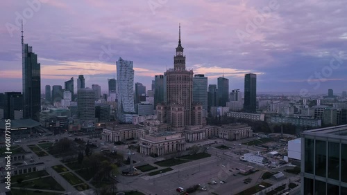 warsaw modern town aerial view at sunrise drone flying out the open window over city center at dawn photo