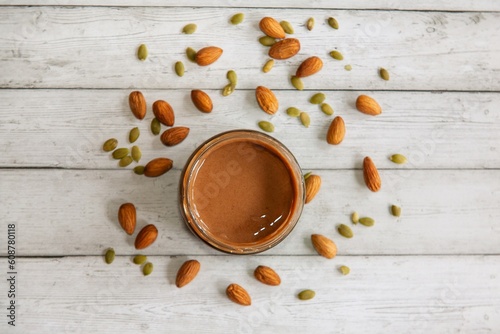 Tableau sur toile nut paste on a background of almond nuts