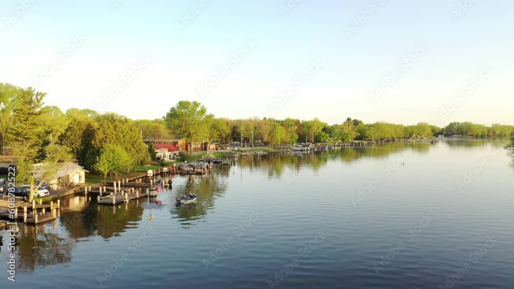 Aerial view of the Midwest during spring summer season. River, Midwestern houses with a private dock, fishing boats Aerial view of the Midwest during spring summer season. River, Midwestern houses with a private dock, fishing boats