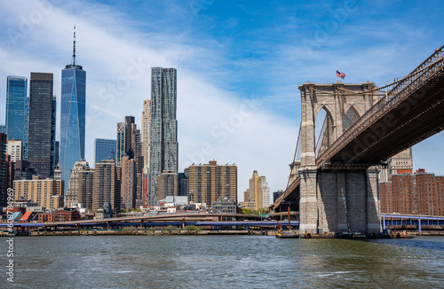 Manhattan skyline, with Brooklyn Bridge to the right and World trade center to the left.