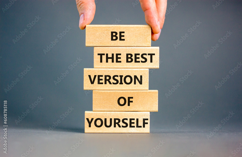 Motivational inspirational symbol. Concept words Be the best version of yourself on wooden block. Beautiful grey background Businessman hand. Business motivational inspirational concept. Copy space.