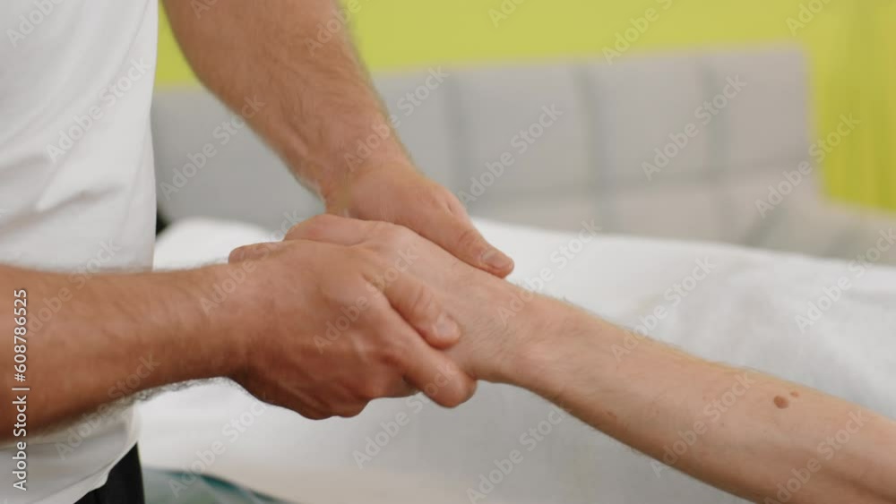 Body relaxation concept the masseur at massage room doing hand massage with oil for his client at medical clinic or spa salon Body relaxation concept the masseur at massage room doing hand massage with oil for his client at medical clinic or spa salon