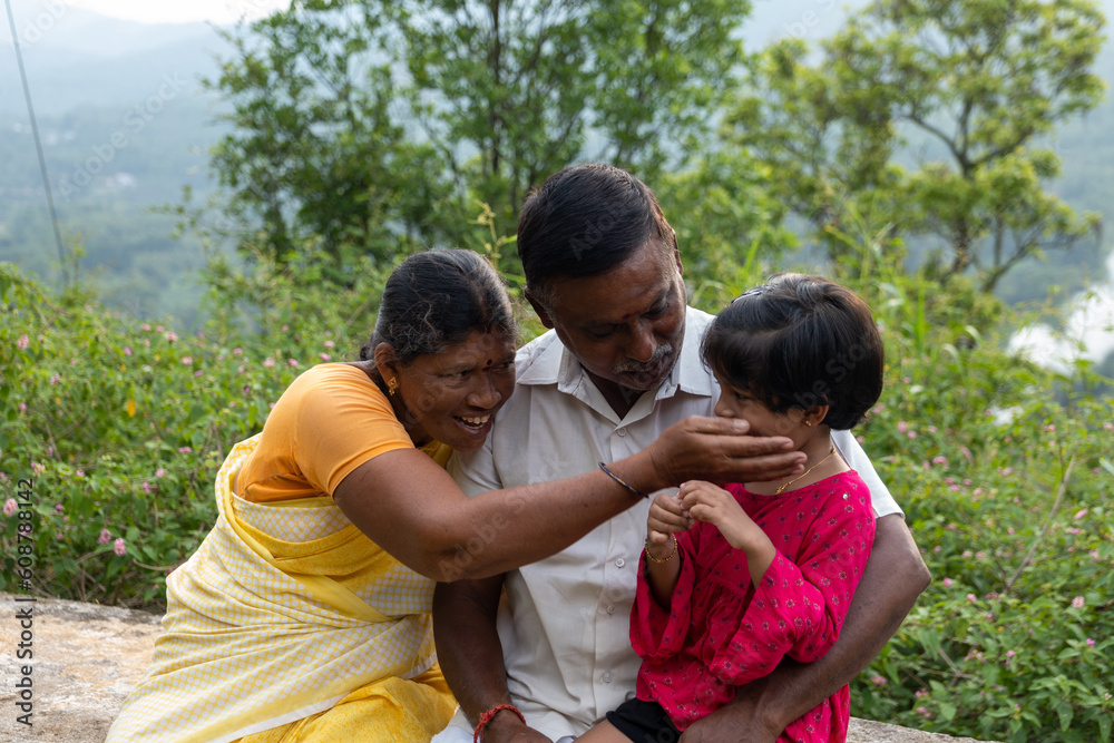Joyful Indian Retired Couple Enjoying a Hill Station Vacation with Granddaughter Joyful Indian Retired Couple Enjoying a Hill Station Vacation with Granddaughter