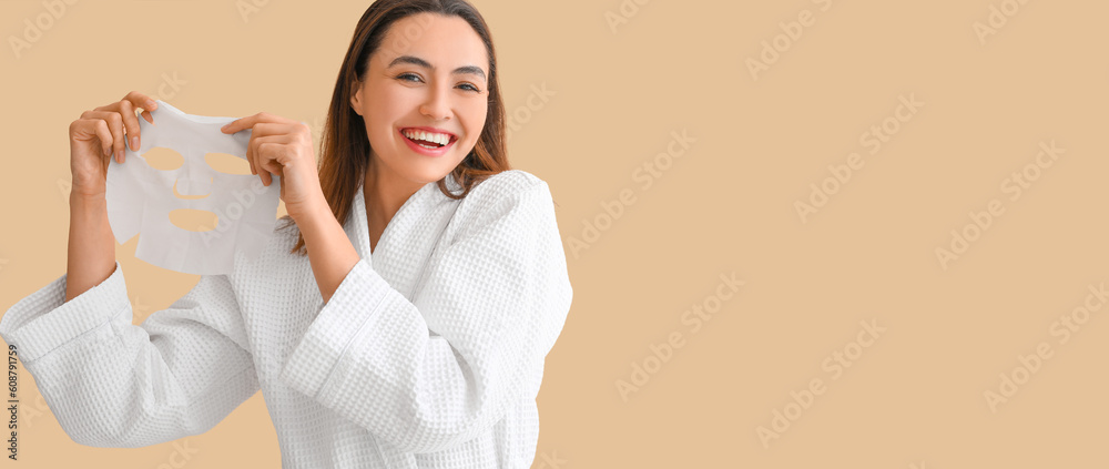 Young woman with sheet facial mask on beige background with space for text Young woman with sheet facial mask on beige background with space for text