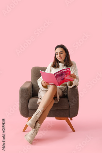 Young woman with magazine s...