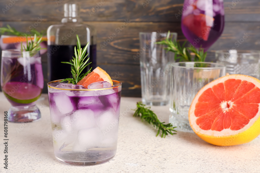 Fototapeta premium Purple gin and tonic with ice on table