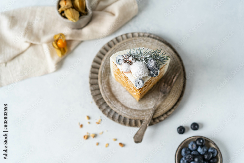 Delicious homemade cake with honey and fresh cream. Homemade dessert for a family holiday.