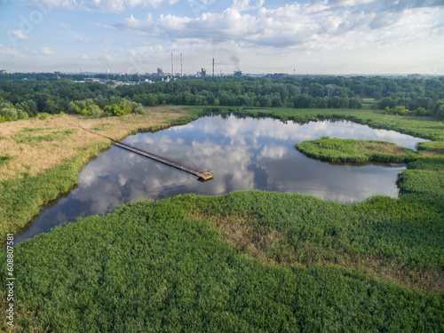 Aerial view of old liquid waste storage used by steel mill, overgrown with plants, Krakow, Poland photo