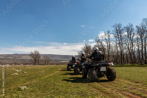 Quad ATV bikes in the middle of the beautiful landscape of the dinara torrent at the border between Croatia and Bosnia in spring outdoors