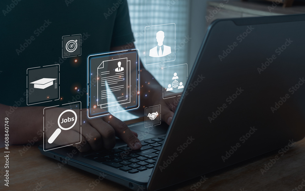 Job search online concept. Man using a computer laptop for searching for job and fill out personal data on job website to file a resume and apply application to jobs on the internet. Job search online concept. Man using a computer laptop for searching for job and fill out personal data on job website to file a resume and apply application to jobs on the internet.