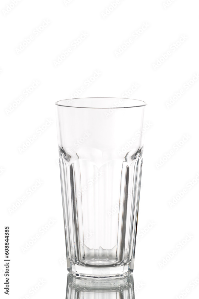 a long empty translucent glass beaker on a white background