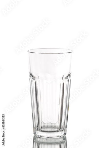 a long empty translucent glass beaker on a white background