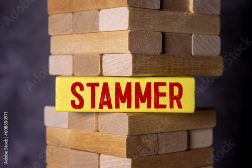 top view blocks with word STAMMER on the white background with pills.