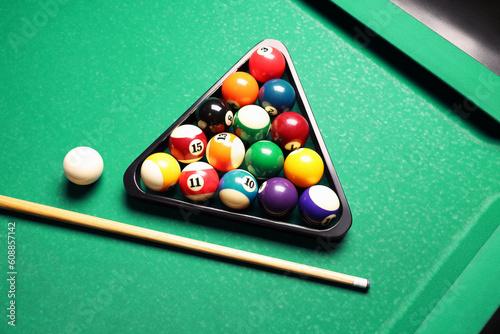 Canvas Print Plastic triangle rack with billiard balls and cue on green table