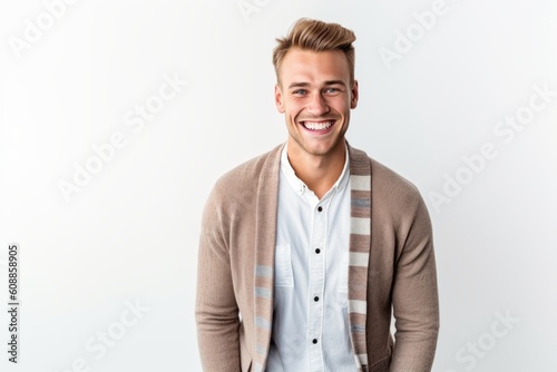 Portrait of a handsome young man smiling at the camera isolated on a white background