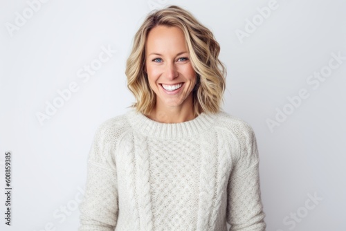 Group portrait photography of a cheerful woman in her 30s that is wearing a cozy sweater against a white background . Generative AI