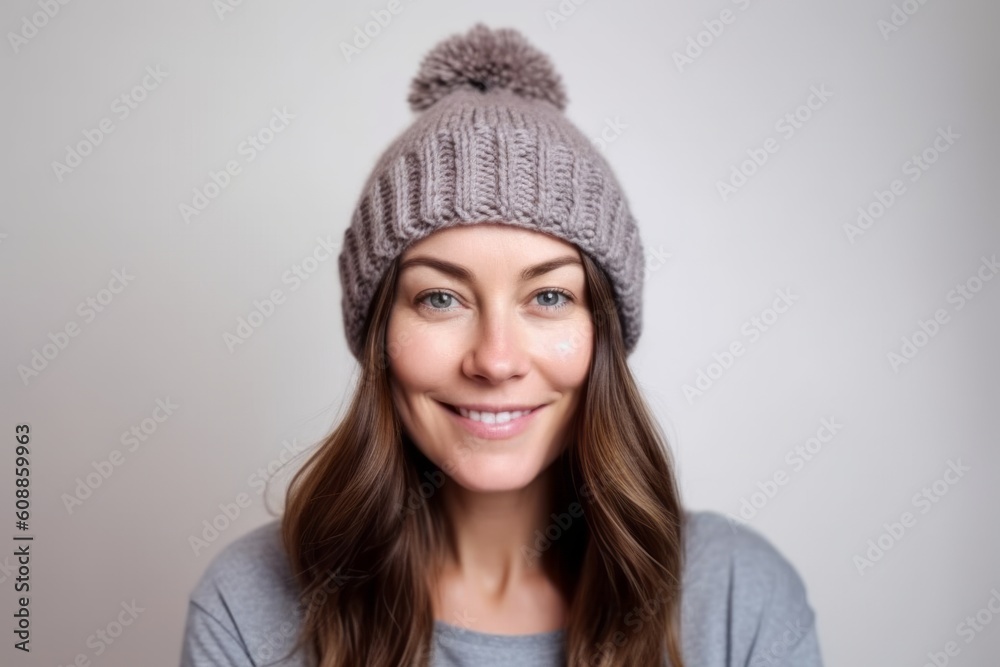 Portrait of a beautiful young woman wearing a knitted hat and sweater Portrait of a beautiful young woman wearing a knitted hat and sweater