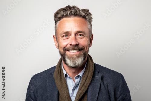 Portrait of a handsome middle-aged man smiling at the camera © Hanne Bauer