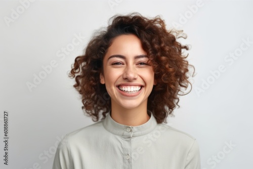 Portrait of beautiful young woman with curly hair on white background.