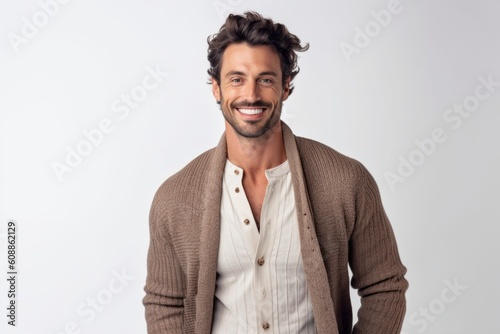 Portrait of a handsome young man smiling at camera isolated on a white background