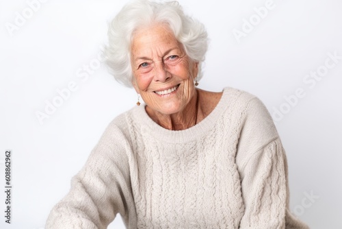 Portrait of a happy senior woman looking at camera on white background