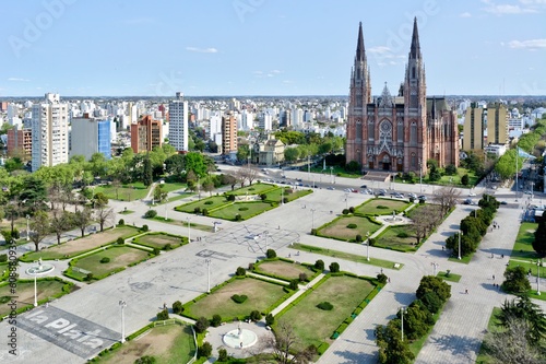 Photo of an aerial view of a La Plata city with a cathedral in the background in Argentina