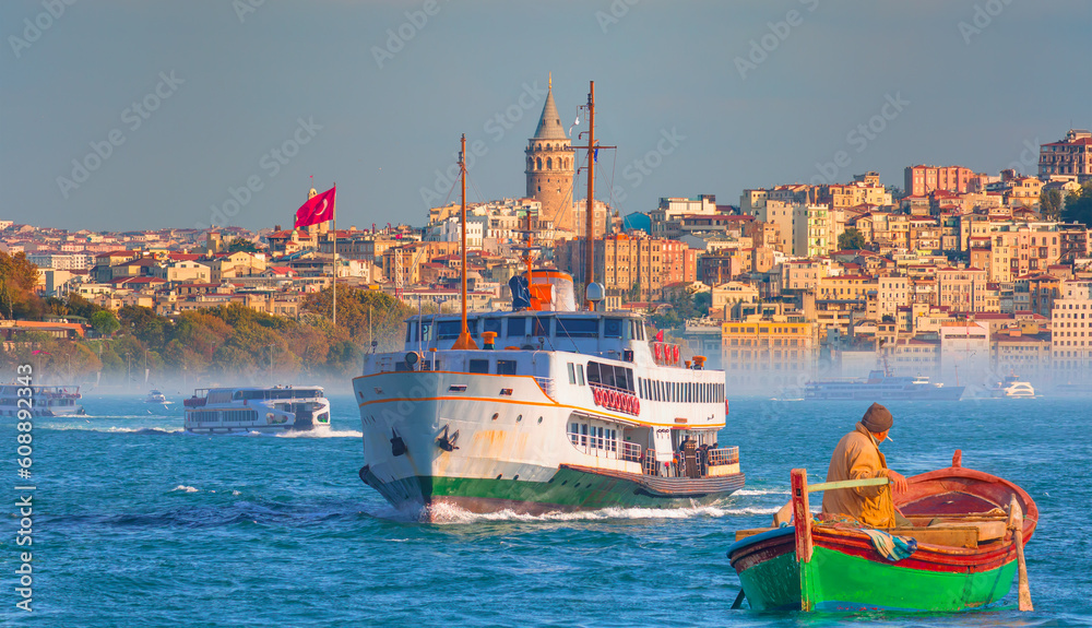 Sea voyage with old ferry (steamboat) in the Bosporus - Galata Tower, Galata Bridge, Karakoy district and Golden Horn, istanbul 